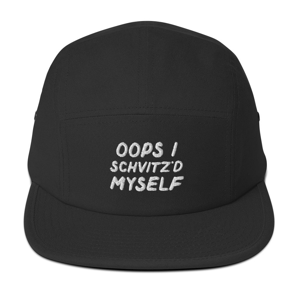 Oops I Schvitz'd Myself 5-panel cap in Black, front view with embroidered phrase