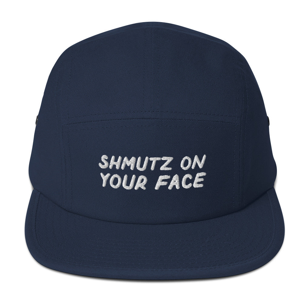 Shmutz on Your Face 5-panel cap in Navy, front view with embroidered phrase