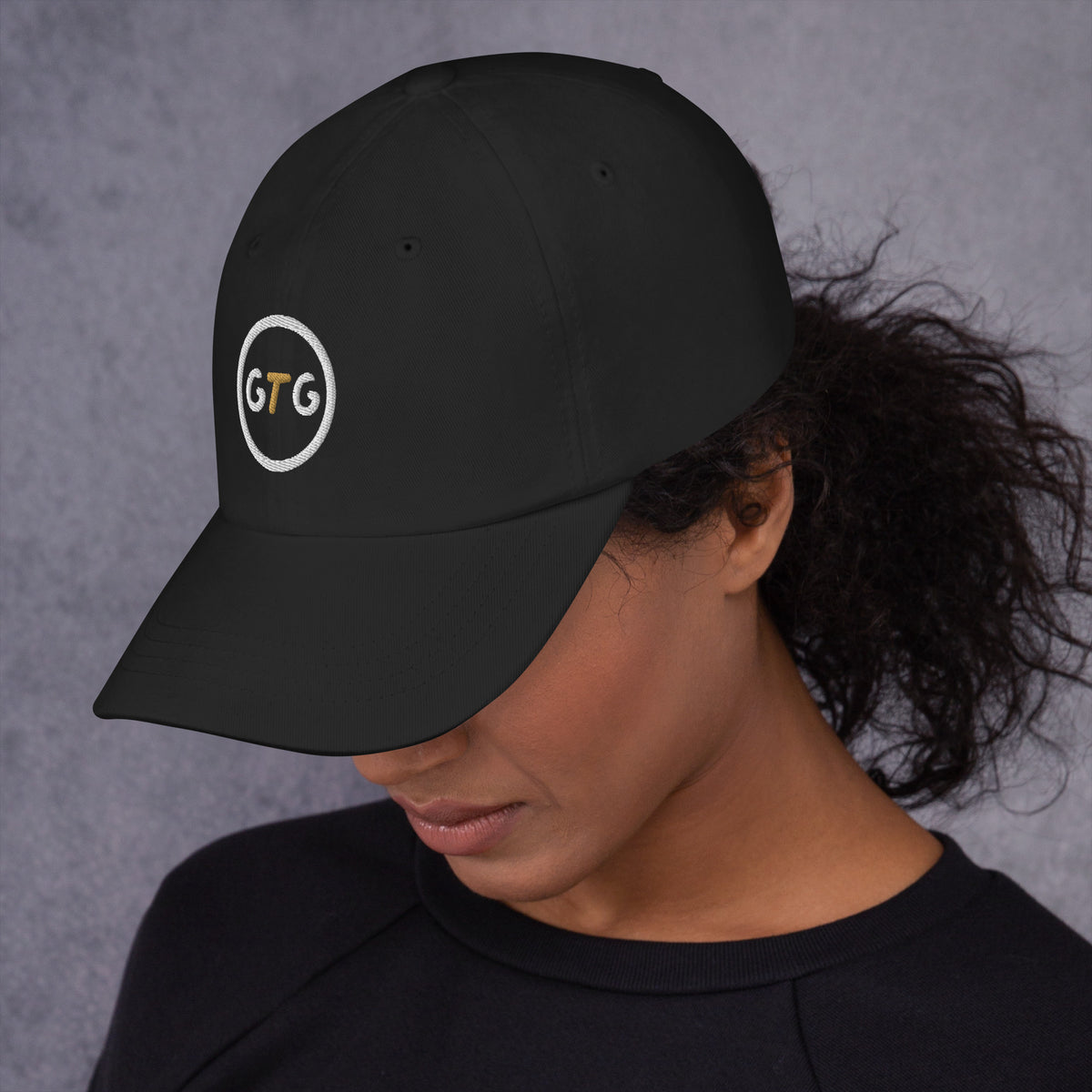 GTG Classic Dad Hat in Black with embroidered GTG badge, left side view