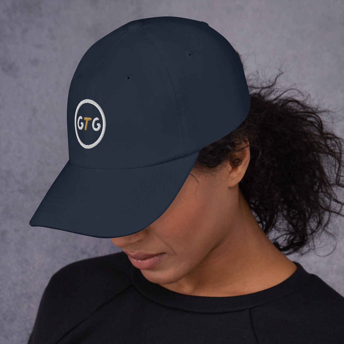 GTG Classic Dad Hat in Navy with embroidered GTG badge, left side view