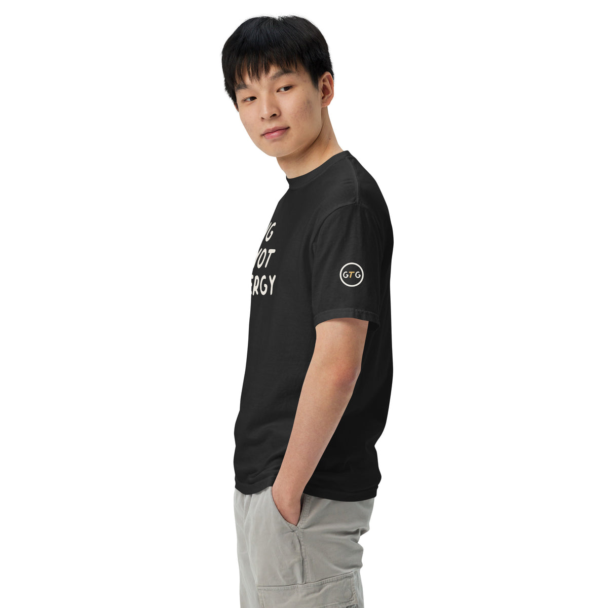Model wearing the Good Thank God Big Payot Energy T-shirt in Black, left side view showing the GTG sleeve badge