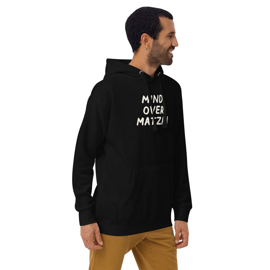 Model wearing the Good Thank God Mind Over Matzah hoodie in Black, right front view