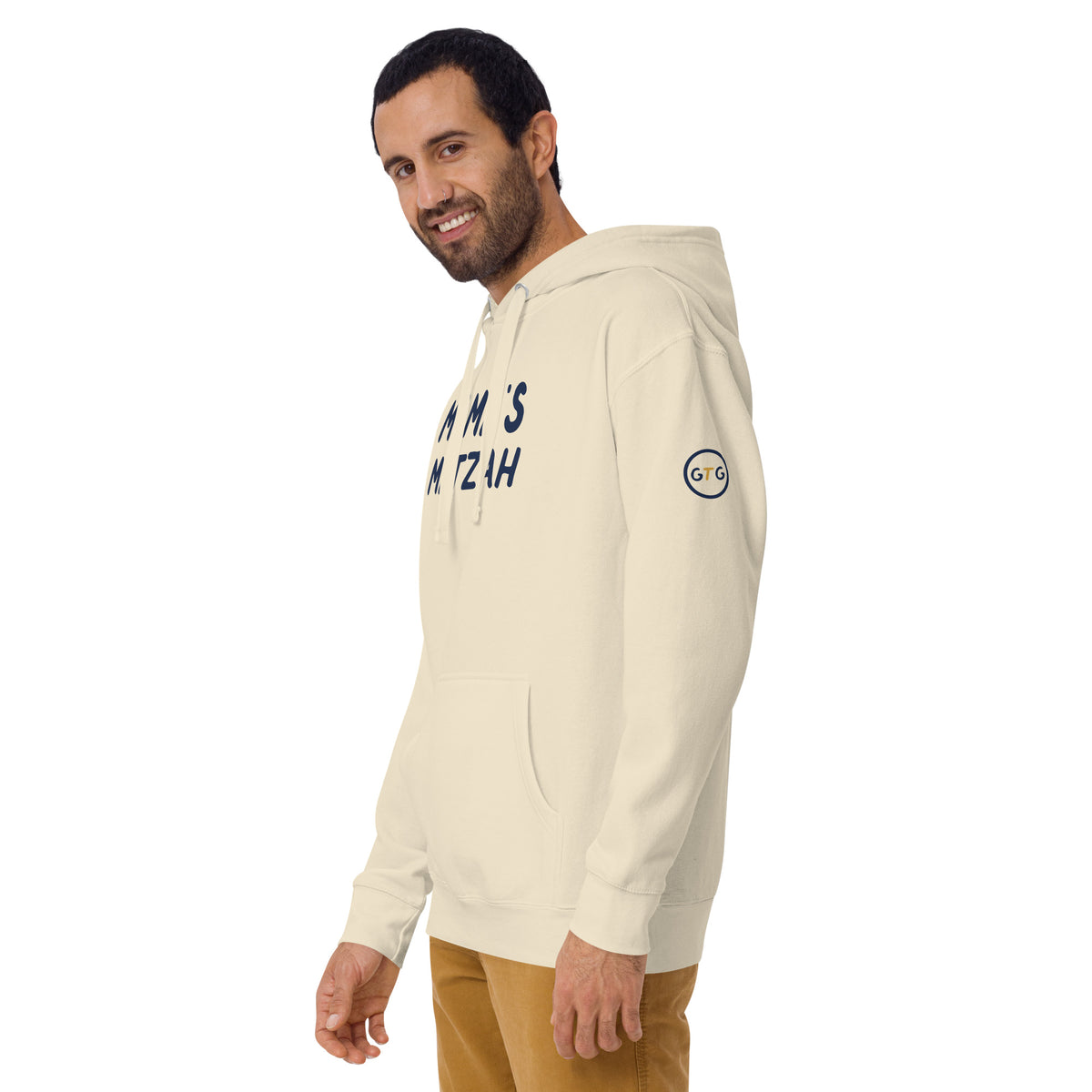 Model wearing the Good Thank God Mama's Matzah hoodie in Bone, left front view showing the GTG sleeve badge