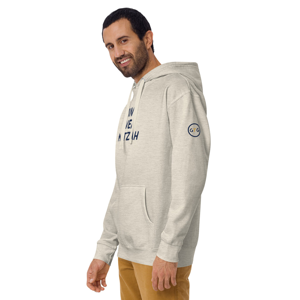 Model wearing the Good Thank God Mind Over Matzah hoodie in Oatmeal Heather, left front view showing the GTG sleeve badge